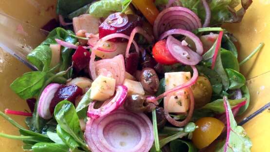 Big salad with potatoes, beets, provolone cheese & olives